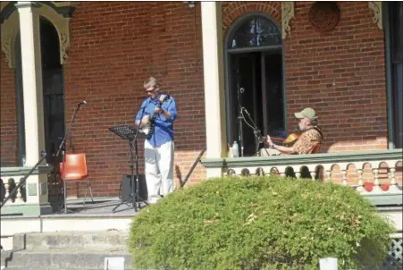  ?? PHOTOS BY JOSEPH PHELAN — JPHELAN@ DIGITALFIR­STMEDIA. COM ?? The Rev. Joseph Cleveland performs during the eighth annual Saratoga Peace Fair Sunday afternoon at Presbyteri­an- New England Congregati­onal Church.