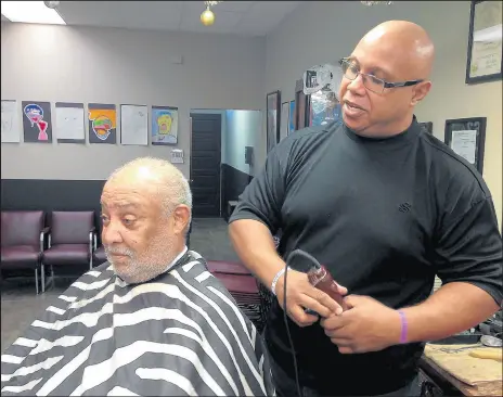  ?? JERRY DAVICH/POST-TRIBUNE ?? Jeffery Colby, third-generation owner of Playboy Barber & Style Shop in Gary, knows listening is a vital part of his job.