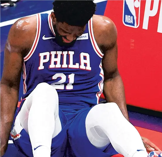  ?? NICK WASS/AP ?? Joel Embiid, who suffered a small tear of the right meniscus from a fall in Monday’s Game 4 loss to the Washington Wizards, seemed to move well during a pregame workout before sitting out the clinching Game 5 victory, but the Sixers have a history of taking a cautious approach with Embiid’s injuries.