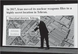  ??  ?? Netanyahu, in front of an oversized aerial map during his April 30 news conference, shows the location of Iran’s atomic archive that was breeched by Mossad agents.