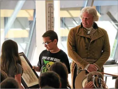  ?? CANDICE MONHOLLAN — DAILY LOCAL NEWS ?? Penn Wood Elementary students presented Thomas Jefferson (Bill Barker) with their own Declaratio­n, signed by each fifth grader as a thank you.