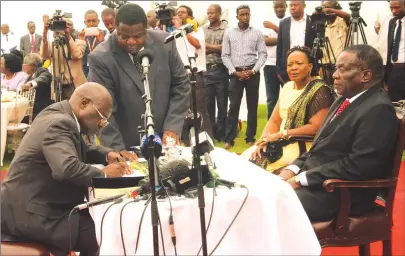  ?? — Picture by Tawanda Mudimu ?? President Mnangagwa swears in Advocate Ray Hemington Goba as substantiv­e Prosecutor-General, while flanked by First Lady Auxillia Mnangagwa at State House in Harare yesterday.