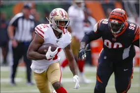  ?? GARY LANDERS — THE ASSOCIATED PRESS ?? 49ers running back Raheem Mostert runs the ball past Bengals defensive tackle Andrew Billings in September 2019. The Browns signed Billings March 19.