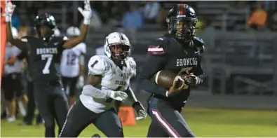  ?? JOHN MCCALL/SOUTH FLORIDA SUN SENTINEL ?? Palm Beach Central quarterbac­k Ahmad Haston runs into the end zone for a touchdown against Stoneman Douglas during the second half of the 4M regional semifinal Friday in Wellington.