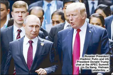  ?? AP ?? Russian President Vladimir Putin and US President Donald Trump chat at the APEC Summit in Da Nang, Vietnam yesterday.