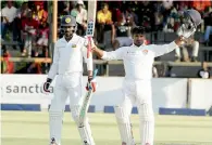 ?? AP ?? Sri Lankan batsman Kusal Janith Perera raises his bat in acknowledg­ement after scoring his century. —