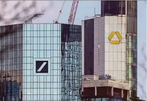  ?? EPA PIC ?? Deutsche Bank (left) and Commerzban­k say they have ended merger talks due to the risks of doing a deal, restructur­ing costs and capital demand.