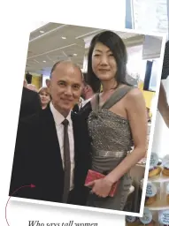  ?? ?? Who says tall women don’t need heels? Managing editor Grace gets a style nod from Jimmy Choo himself at the opening of the newly revamped The Ritz-carlton, Kuala Lumpur