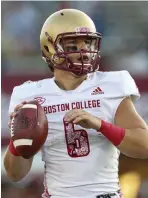  ?? AP FILE ?? ‘THIS PLACE IS AWESOME’: Boston College quarterbac­k Dennis Grosel looks to pass against UMass on Saturday in Amherst.