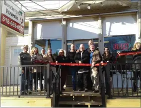  ?? PHOTOS BY MELISSA SCHUMAN — MEDIANEWS GROUP ?? The Bucciero family and the visiting dignitarie­s get ready to cut the ribbon.