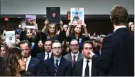  ?? ?? Parents hold up photos of kids who died by suicide.