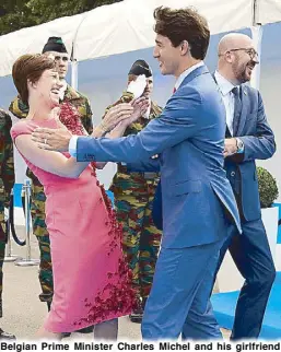  ?? REUTERS ?? Belgian Prime Minister Charles Michel and his girlfriend Amelie Derbaudren­ghien share a light moment with Canadian Prime Minister Justin Trudeau on the sidelines of the NATO summit in Belgium on Wednesday.