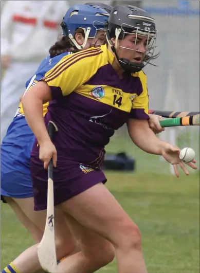  ??  ?? Full-forward Una Leacy is closely policed by Tipperary defender Julie Anne Bourke.