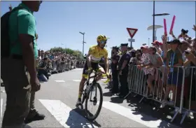  ?? THIBAULT CAMUS - THE ASSOCIATED PRESS ?? France’s Julian Alaphilipp­e wearing the overall leader’s yellow jerse arrives for the start of the fifth stage of the Tour de France cycling race over 175.5 kilometers (109 miles) with start in Saint-Die-Des-Vosges and finish in Colmar, Wednesday, July 10, 2019.