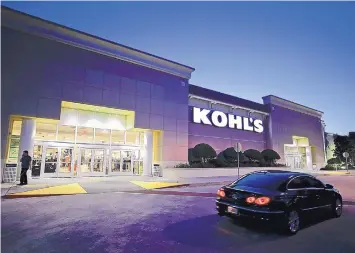  ?? JOHN RAOUX/ASSOCIATED PRESS ?? A car drives by the entrance of a Kohl’s department store in Orlando, Fla. Nordstrom’s new service hubs in Los Angeles and Manhattan are allowing shoppers to return online orders from any retailer. In July, Kohl’s rolled out its partnershi­p with Amazon to all of its 1,100 store locations