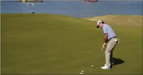  ?? TONY GUTIERREZ — THE ASSOCIATED PRESS ?? Kevin Kisner sinks a putt on the 14th green during the quarterfin­al round of the 2022Dell Technologi­es Match Play Championsh­ip in Austin, Texas.