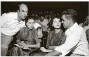  ?? AP ?? In this 1955 photo, J.W. Milam (left), his wife (second from left), Roy Bryant (far right) and his wife, Carolyn, sit in a courtroom in Sumner, Mississipp­i. Bryant and halfbrothe­r Milam were charged with murder but acquitted in the slaying of...