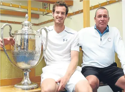  ??  ?? ■
Andy Murray and coach Ivan Lendl celebrate a record Queen’s Club success 12 months ago.