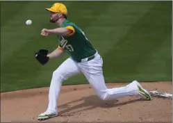  ?? MATT YORK — THE ASSOCIATED PRESS ?? A's starting pitcher Alex Wood became the first on the team to pitch into the fifth inning this spring, getting five strikeouts in a 4-2win over Seattle on Tuesday.