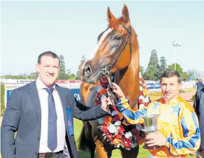  ?? Photo / Race Images South ?? Part-owner Paul Gallen and jockey Opie Bosson with Te Akau Shark after his win in the Gr.2 Coupland’s Bakeries Mile.