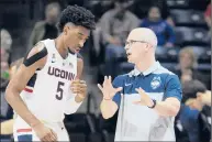  ?? JOHN WOIKE/ HARTFORD COURANT ?? UConn Huskies head coach Dan Hurley has some advice for forward Isaiah Whaley (5) during a timeout. The Huskies open their season Thursday against Morehead State.