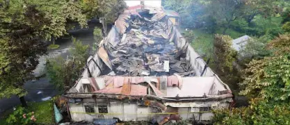  ?? LYN RILLON ?? NOMORE strikes or spares for now as a fire destroyed the bowling alley at the UP Alumni Center on the UP Diliman campus on Tuesday night. No one was hurt in the second fire to hit the campus in three weeks.