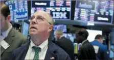  ?? RICHARD DREW — THE ASSOCIATED PRESS ?? Trader Frederick Reimer works on the floor of the New York Stock Exchange on Tuesday.