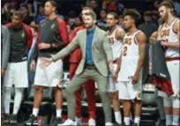  ?? HOWARD SIMMONS — THE ASSOCIATED PRESS ?? Kevin Love and the rest of the bench looks on during the Cavaliers’ victory over the Nets on Dec. 3 in New York.