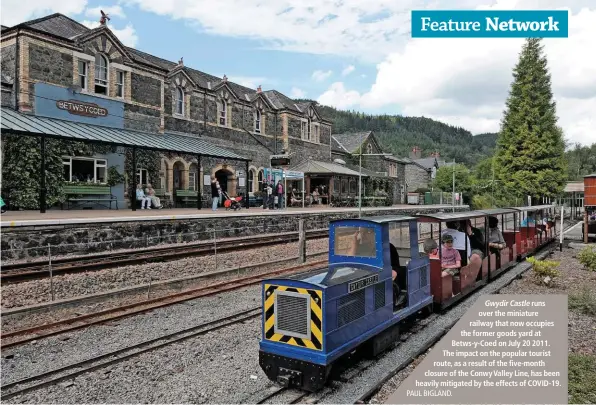  ??  ?? Gwydir Castle runs over the miniature railway that now occupies the former goods yard at Betws-y-Coed on July 20 2011. The impact on the popular tourist route, as a result of the five-month closure of the Conwy Valley Line, has been heavily mitigated by the effects of COVID-19. PAUL BIGLAND.