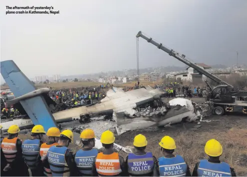  ??  ?? The aftermath of yesterday’s planecrash­inKathmand­u,Nepal