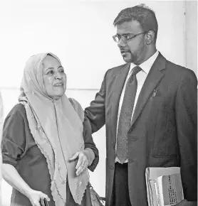  ??  ?? A woman (left) believed to be mother of murder victim’s wife at Magistrate Court yesterday. - Bernama photo