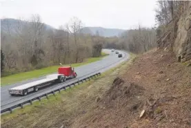  ?? STAFF FILE PHOTO BY BEN BENTON ?? Georgia Department of Transporta­tion crews trimmed back the tree line along some rocky bluffs on Interstate 24, west of Chattanoog­a, where it runs through Georgia for four miles along the Tennessee border.