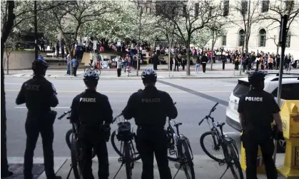  ?? Photograph: Kathy Plonka/AP ?? Police are positioned across the street during Planned Parenthood abortion-rights rally in front of the federal courthouse in Spokane, Washington, on 3 May 2022.