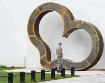  ?? IRON-HEARTED: — Reuters ?? A giant iron heart sculpture, designed by artist David Appleyard is seen in Penderyn Square, Merthyr Tydfil town centre, Wales.