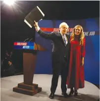  ?? (Phil Noble/Reuters) ?? BRITISH PRIME MINISTER Boris Johnson and his wife, Carrie, exit the stage of the Conservati­ve Party Conference in Manchester yesterday.