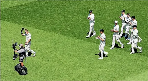  ?? GETTY IMAGES ?? Neil Wagner is applauded off the Basin Reserve by his Black Caps team-mates after taking seven wickets on the first day of the test against the West Indies last year.