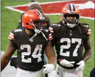  ?? RON SCHWANE — THE ASSOCIATED PRESS ?? Nick Chubb and Kareem Hunt walk off the field Nov. 15.