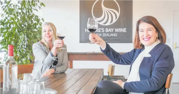  ?? Photos / Warren Buckland ?? LEFT: HB Wine Growers chairwoman Sally Duncan and Hastings mayor Sandra Hazlehurst raise a glass in celebratio­n of the opening of the Cellar
Door on East Block in Hastings.
BELOW: A small example of the wines available at the cellar door in the heart of Hastings.