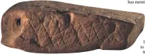 ??  ?? The lines etched into this 75,000-year-old piece of ochre from Blombos Cave might show early symbolic thinking.