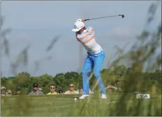  ??  ?? Rickie Fowler hits from the 13th tee during the first round of the U.S. Open golf tournament Thursday at Erin Hills in Erin, Wis. AP PHOTO