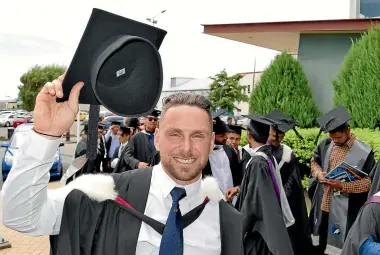  ?? JOHN HAWKINS/ STUFF ?? Elite Southland cyclist Eddie Dawkins moments before he received his Bachelor of Sport and Exercise from the Southern Institute of Technology yesterday.