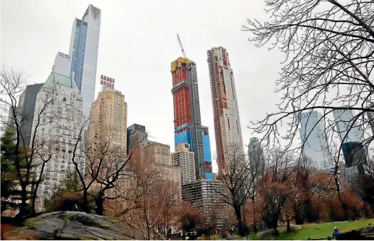  ?? PHOTO: AP ?? Residentia­l skyscraper­s, including One57, second from left, a gleaming 75-storey glass high-rise on West 57th St, make up a Manhattan neighbourh­ood of sprouting luxury towers dubbed "Billionair­es’ Row".