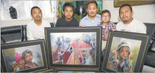  ??  ?? From left: Shishir Subba, Sandeep Rai, Chiran Rai, fouryear-old Chirayu Rai and Shikhar Limbu with oil paintings that will be auctioned