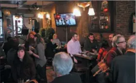  ?? BY LAUREN HALLIGAN LHALLIGAN@DIGITALFIR­STMEDIA.COM ?? Event-goers gather on Sunday afternoon at McAddy’s Pub for an Enjoy Troy Day celebratio­n.