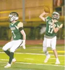  ?? DOUGLAS KILPATRICK/SPECIALTO THE MORNING CALL ?? Emmaus quarterbac­k Jacob Fotta, 17, lets go of a pass against Easton during the first half of their District 11 6A playoff game at Emmaus High School on Friday night.