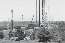  ?? [THE OKLAHOMAN ARCHIVES] ?? Rigs drill wells near Chickasha in 2018.