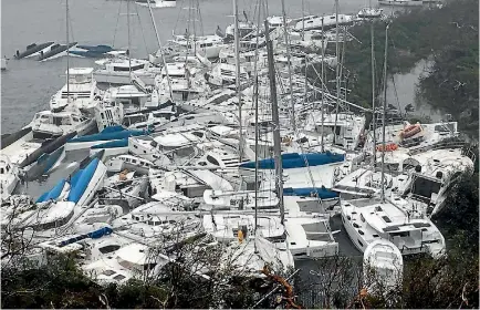  ?? PHOTO: REUTERS ?? Pleasure boats lie sunk and crammed against the shore in Paraquita Bay in the British Virgin Islands in the wake of Hurricane Irma. The Category 5 storm has ravaged several Caribbean island nations, and is on track to make landfall in Florida during...