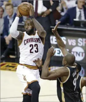  ?? TONY DEJAK — THE ASSOCIATED PRESS ?? LeBron James looks to pass as the Raptors’ Serge Ibaka defends during the second half of the Cavaliers’ 125-103 win that gave them a 2-0 lead in the best-of-seven series.