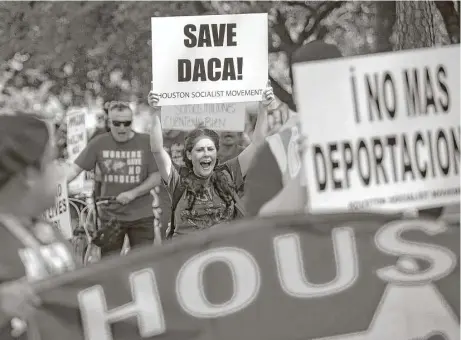  ?? Annie Mulligan photos ?? University of Houston Clear Lake professor Angela Miller chants and marches in support of DACA recipients Saturday in Moody Park.