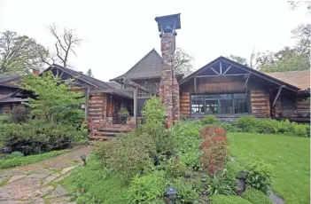  ?? CHELSEY LEWIS / MILWAUKEE JOURNAL SENTINEL ?? Stout's Island Lodge was built in 1912 as a private island retreat for the family of Frank Stout, one of Chicago's wealthiest men. Today the resort is open to overnight visitors in the summer.